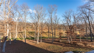 This exceptional residence has a wall of windows providing a on Osage National Golf Club in Missouri - for sale on GolfHomes.com, golf home, golf lot