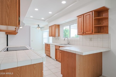 This well-maintained Capistrano offers vaulted ceilings that on Echo Mesa Golf Course in Arizona - for sale on GolfHomes.com, golf home, golf lot