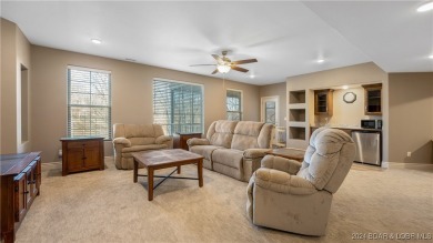 This exceptional residence has a wall of windows providing a on Osage National Golf Club in Missouri - for sale on GolfHomes.com, golf home, golf lot