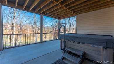 This exceptional residence has a wall of windows providing a on Osage National Golf Club in Missouri - for sale on GolfHomes.com, golf home, golf lot