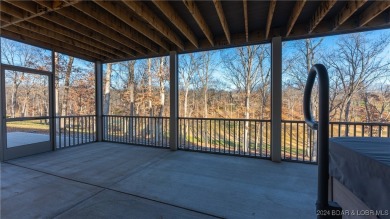 This exceptional residence has a wall of windows providing a on Osage National Golf Club in Missouri - for sale on GolfHomes.com, golf home, golf lot