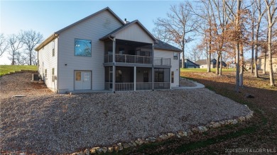 This exceptional residence has a wall of windows providing a on Osage National Golf Club in Missouri - for sale on GolfHomes.com, golf home, golf lot