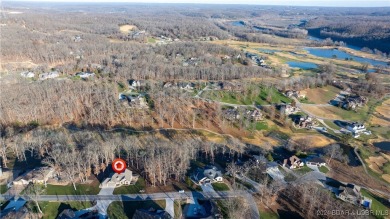 This exceptional residence has a wall of windows providing a on Osage National Golf Club in Missouri - for sale on GolfHomes.com, golf home, golf lot