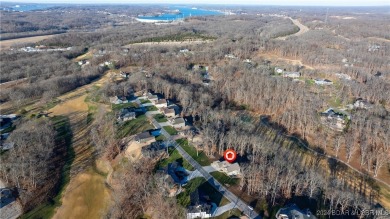 This exceptional residence has a wall of windows providing a on Osage National Golf Club in Missouri - for sale on GolfHomes.com, golf home, golf lot