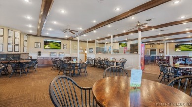 This exceptional residence has a wall of windows providing a on Osage National Golf Club in Missouri - for sale on GolfHomes.com, golf home, golf lot