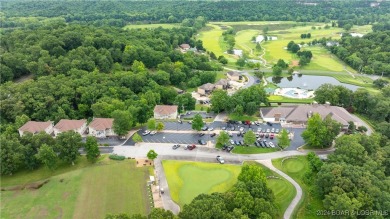 This exceptional residence has a wall of windows providing a on Osage National Golf Club in Missouri - for sale on GolfHomes.com, golf home, golf lot