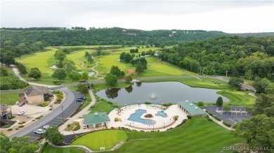 This exceptional residence has a wall of windows providing a on Osage National Golf Club in Missouri - for sale on GolfHomes.com, golf home, golf lot