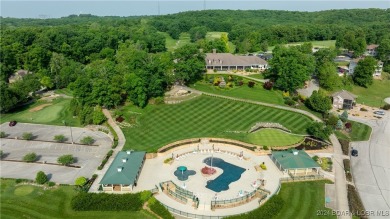 This exceptional residence has a wall of windows providing a on Osage National Golf Club in Missouri - for sale on GolfHomes.com, golf home, golf lot