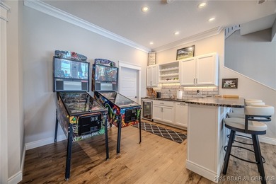 Introducing East Villages! An exquisite lakefront property on The Club At Porto Cima in Missouri - for sale on GolfHomes.com, golf home, golf lot