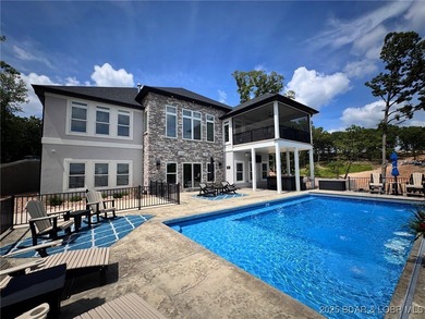 Introducing East Villages! An exquisite lakefront property on The Club At Porto Cima in Missouri - for sale on GolfHomes.com, golf home, golf lot