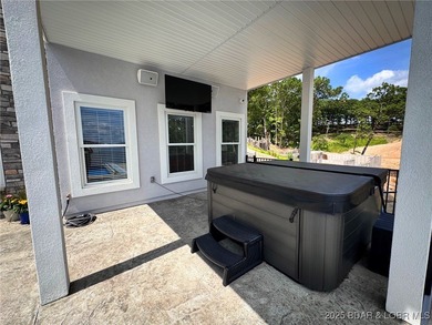 Introducing East Villages! An exquisite lakefront property on The Club At Porto Cima in Missouri - for sale on GolfHomes.com, golf home, golf lot