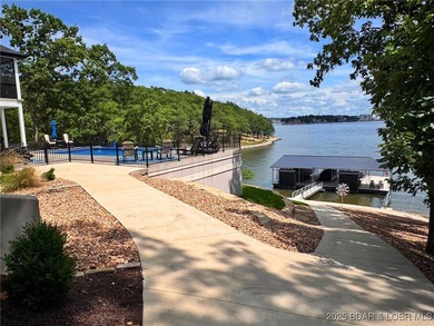 Introducing East Villages! An exquisite lakefront property on The Club At Porto Cima in Missouri - for sale on GolfHomes.com, golf home, golf lot