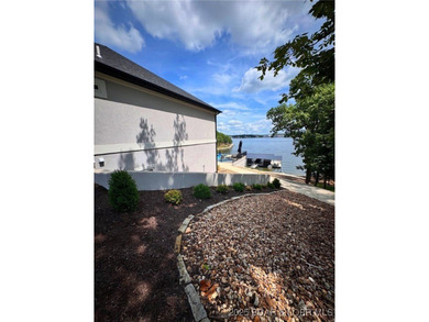 Introducing East Villages! An exquisite lakefront property on The Club At Porto Cima in Missouri - for sale on GolfHomes.com, golf home, golf lot