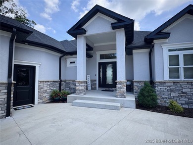 Introducing East Villages! An exquisite lakefront property on The Club At Porto Cima in Missouri - for sale on GolfHomes.com, golf home, golf lot