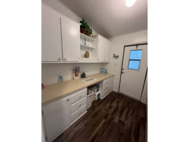 Welcome to this well-maintained and mostly furnished home in a on Lake Henry Golf Club in Florida - for sale on GolfHomes.com, golf home, golf lot