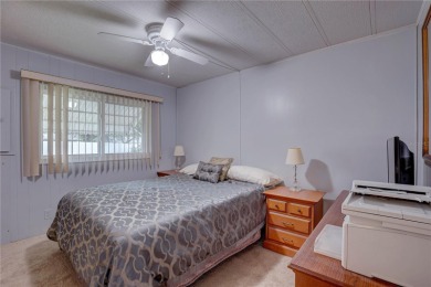 Your Resort-Style Oasis Awaits at 113 Royal Palms Circle, Largo on Palm Hill Golf Club in Florida - for sale on GolfHomes.com, golf home, golf lot