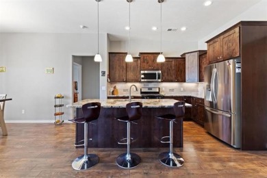 Welcome to this beautifully maintained 4-bedroom, 2-bath home in on Adobe Creek National Golf Course in Colorado - for sale on GolfHomes.com, golf home, golf lot