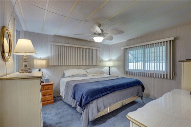 Your Resort-Style Oasis Awaits at 113 Royal Palms Circle, Largo on Palm Hill Golf Club in Florida - for sale on GolfHomes.com, golf home, golf lot