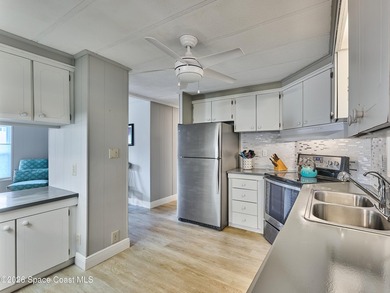 Beautifully updated home offering spacious, relaxed living with on Barefoot Bay Golf Course in Florida - for sale on GolfHomes.com, golf home, golf lot