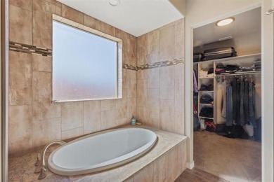 Welcome to this beautifully maintained 4-bedroom, 2-bath home in on Adobe Creek National Golf Course in Colorado - for sale on GolfHomes.com, golf home, golf lot
