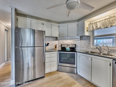 Beautifully updated home offering spacious, relaxed living with on Barefoot Bay Golf Course in Florida - for sale on GolfHomes.com, golf home, golf lot