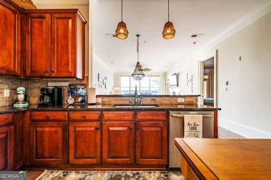 Welcome home to this stunning Lake Oconee condo within the on The Golf Club at Cuscowilla in Georgia - for sale on GolfHomes.com, golf home, golf lot