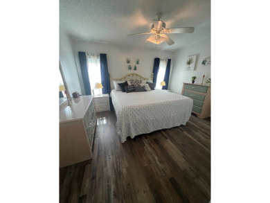 Welcome to this well-maintained and mostly furnished home in a on Lake Henry Golf Club in Florida - for sale on GolfHomes.com, golf home, golf lot