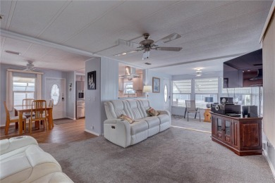 Your Resort-Style Oasis Awaits at 113 Royal Palms Circle, Largo on Palm Hill Golf Club in Florida - for sale on GolfHomes.com, golf home, golf lot