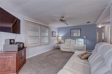 Your Resort-Style Oasis Awaits at 113 Royal Palms Circle, Largo on Palm Hill Golf Club in Florida - for sale on GolfHomes.com, golf home, golf lot