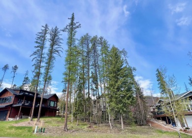 An elevated building lot on the west side of town overlooking on Whitefish Lake Golf Club in Montana - for sale on GolfHomes.com, golf home, golf lot