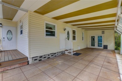 Your Resort-Style Oasis Awaits at 113 Royal Palms Circle, Largo on Palm Hill Golf Club in Florida - for sale on GolfHomes.com, golf home, golf lot