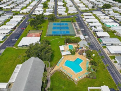 Your Resort-Style Oasis Awaits at 113 Royal Palms Circle, Largo on Palm Hill Golf Club in Florida - for sale on GolfHomes.com, golf home, golf lot