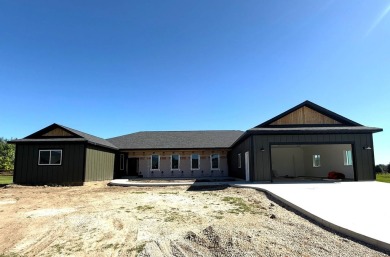 This beautiful new home in the Powder Horn Golf Community offers on The Powder Horn Golf Club - Mountain in Wyoming - for sale on GolfHomes.com, golf home, golf lot