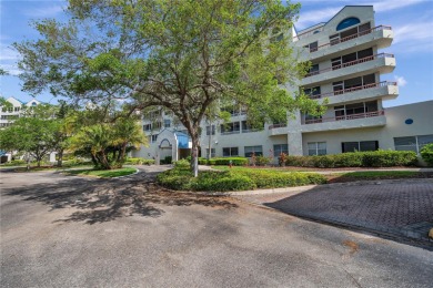 Welcome to Crystal Bay, an elegant oasis nestled within the on Feather Sound Country Club in Florida - for sale on GolfHomes.com, golf home, golf lot