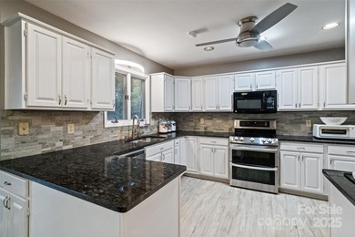 Welcome to this vintage gem in the heart of Tega Cay's peninsula on Tega Cay Golf Club in South Carolina - for sale on GolfHomes.com, golf home, golf lot