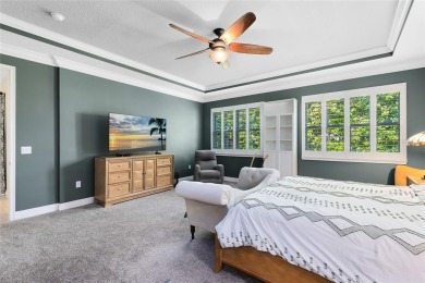 This stunning 5-bed, 5-bath Jones Homes masterpiece with water on Eagle Creek Golf Club in Florida - for sale on GolfHomes.com, golf home, golf lot