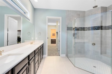 This stunning 5-bed, 5-bath Jones Homes masterpiece with water on Eagle Creek Golf Club in Florida - for sale on GolfHomes.com, golf home, golf lot