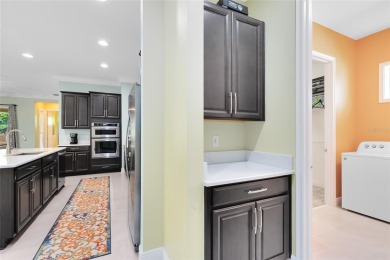 This stunning 5-bed, 5-bath Jones Homes masterpiece with water on Eagle Creek Golf Club in Florida - for sale on GolfHomes.com, golf home, golf lot