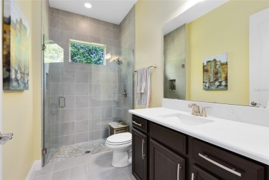 This stunning 5-bed, 5-bath Jones Homes masterpiece with water on Eagle Creek Golf Club in Florida - for sale on GolfHomes.com, golf home, golf lot