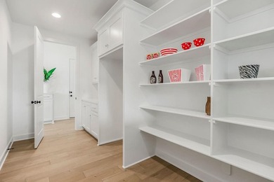 This is a MODEL HOME. You will want to see this gorgeous brand on Heritage Park Golf Course in Kansas - for sale on GolfHomes.com, golf home, golf lot