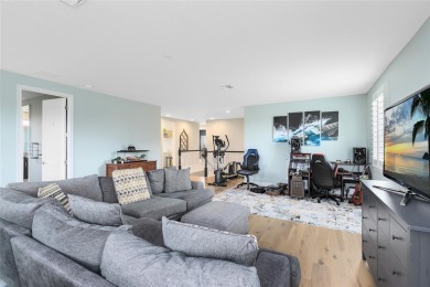 This stunning 5-bed, 5-bath Jones Homes masterpiece with water on Eagle Creek Golf Club in Florida - for sale on GolfHomes.com, golf home, golf lot