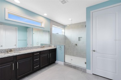 This stunning 5-bed, 5-bath Jones Homes masterpiece with water on Eagle Creek Golf Club in Florida - for sale on GolfHomes.com, golf home, golf lot