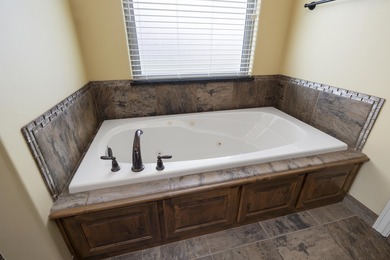 Located in the San Poppi Millwood golf community. This 4 bed, 2 on Millwood Golf and Racquet Club in Missouri - for sale on GolfHomes.com, golf home, golf lot