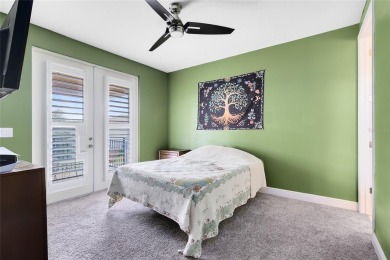 This stunning 5-bed, 5-bath Jones Homes masterpiece with water on Eagle Creek Golf Club in Florida - for sale on GolfHomes.com, golf home, golf lot