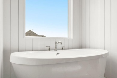 This is a MODEL HOME. You will want to see this gorgeous brand on Heritage Park Golf Course in Kansas - for sale on GolfHomes.com, golf home, golf lot