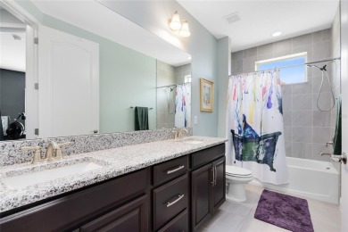 This stunning 5-bed, 5-bath Jones Homes masterpiece with water on Eagle Creek Golf Club in Florida - for sale on GolfHomes.com, golf home, golf lot