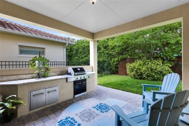 This stunning 5-bed, 5-bath Jones Homes masterpiece with water on Eagle Creek Golf Club in Florida - for sale on GolfHomes.com, golf home, golf lot