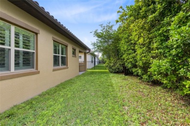 This stunning 5-bed, 5-bath Jones Homes masterpiece with water on Eagle Creek Golf Club in Florida - for sale on GolfHomes.com, golf home, golf lot
