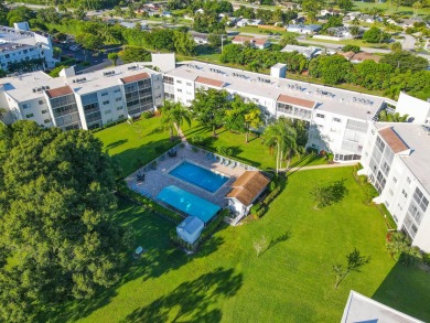 PENTHOUSE VIEWS WELCOME YOU TO  GOLF,POOL & GARDEN VIEWS FROM A on Poinciana Golf Club in Florida - for sale on GolfHomes.com, golf home, golf lot