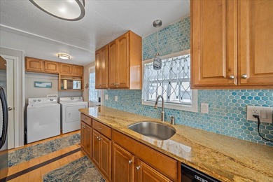 Under contract-accepting backup offers. Welcome home to easy on Pelican Pointe Golf and Country Club in Florida - for sale on GolfHomes.com, golf home, golf lot